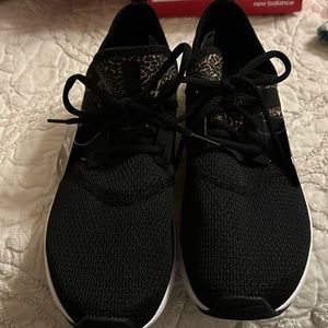 New Balance black with animal print accents. Never worn,original box with tags.